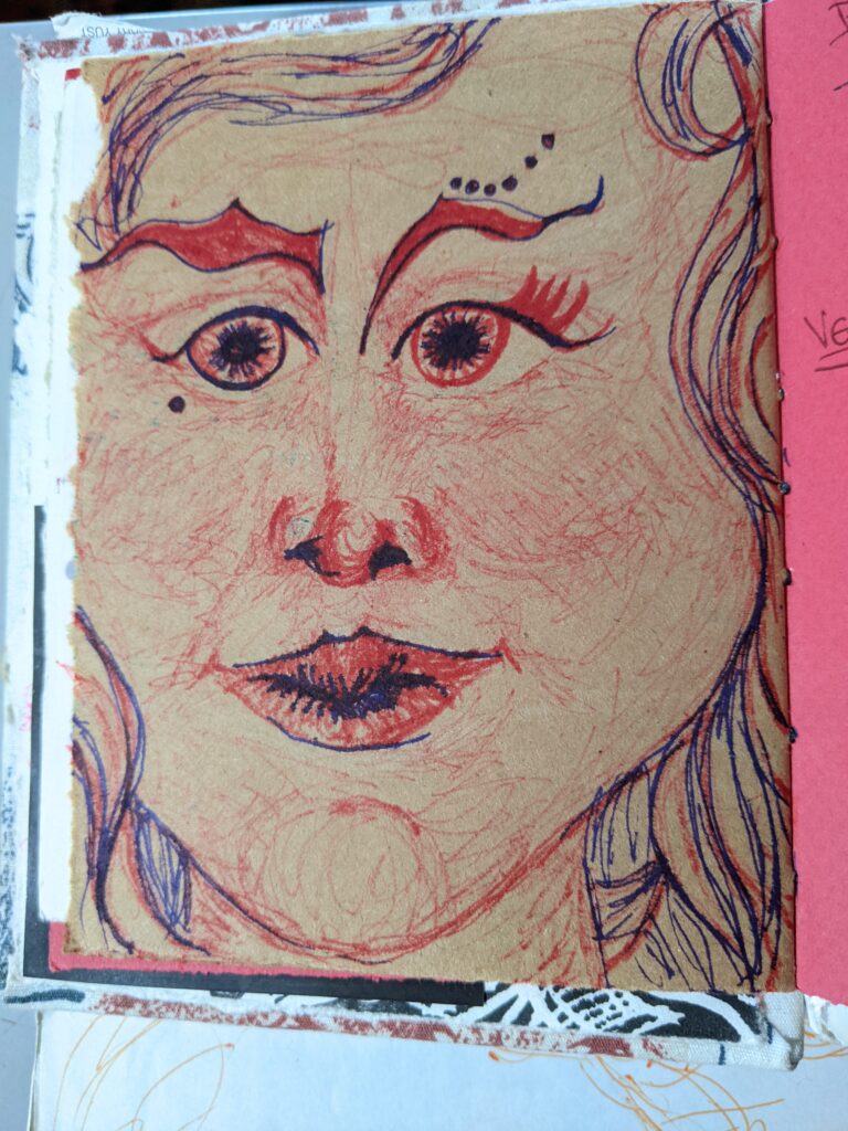 A sketchbook drawing in red of a woman with long curly hair.